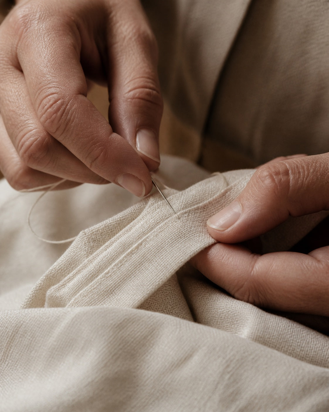 Artisan hand-stitching natural linen